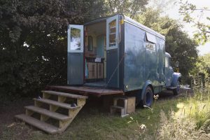 Martha at Day's Cottage by hedge